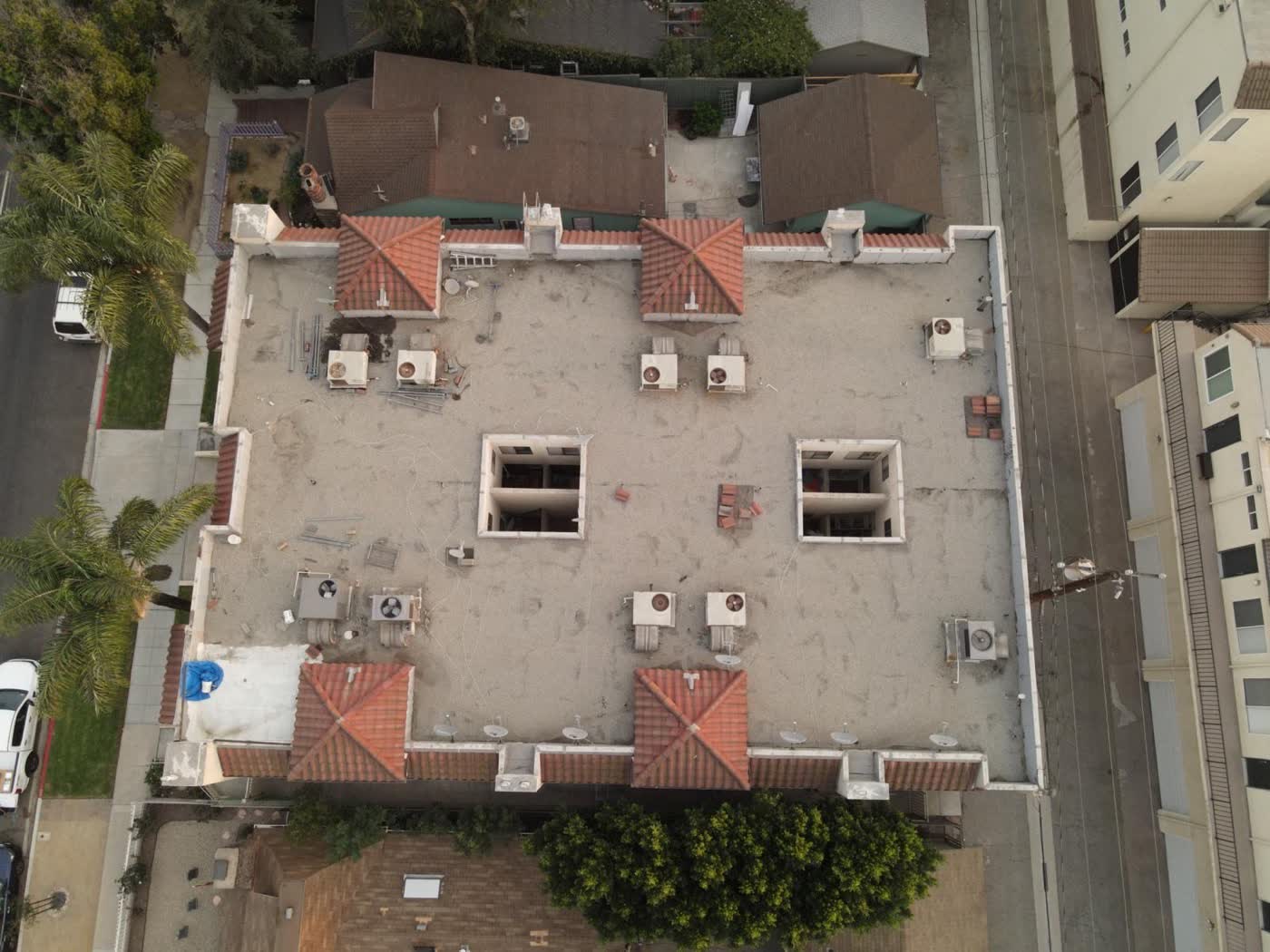 Multi-family flat roof replacement — before